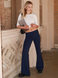 front view of model wearing Princess Polly Kinkirk Flared Pants Navy Pinstripe Low Rise Pants 
