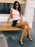 side view of model wearing Princess Polly Cheirosa Off Shoulder Top White / Red Short Sleeves straight