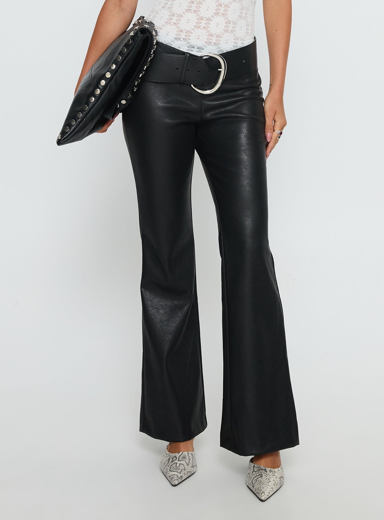 side view of model wearing Princess Polly Azria Faux Leather Pants Black Low Rise Pants 