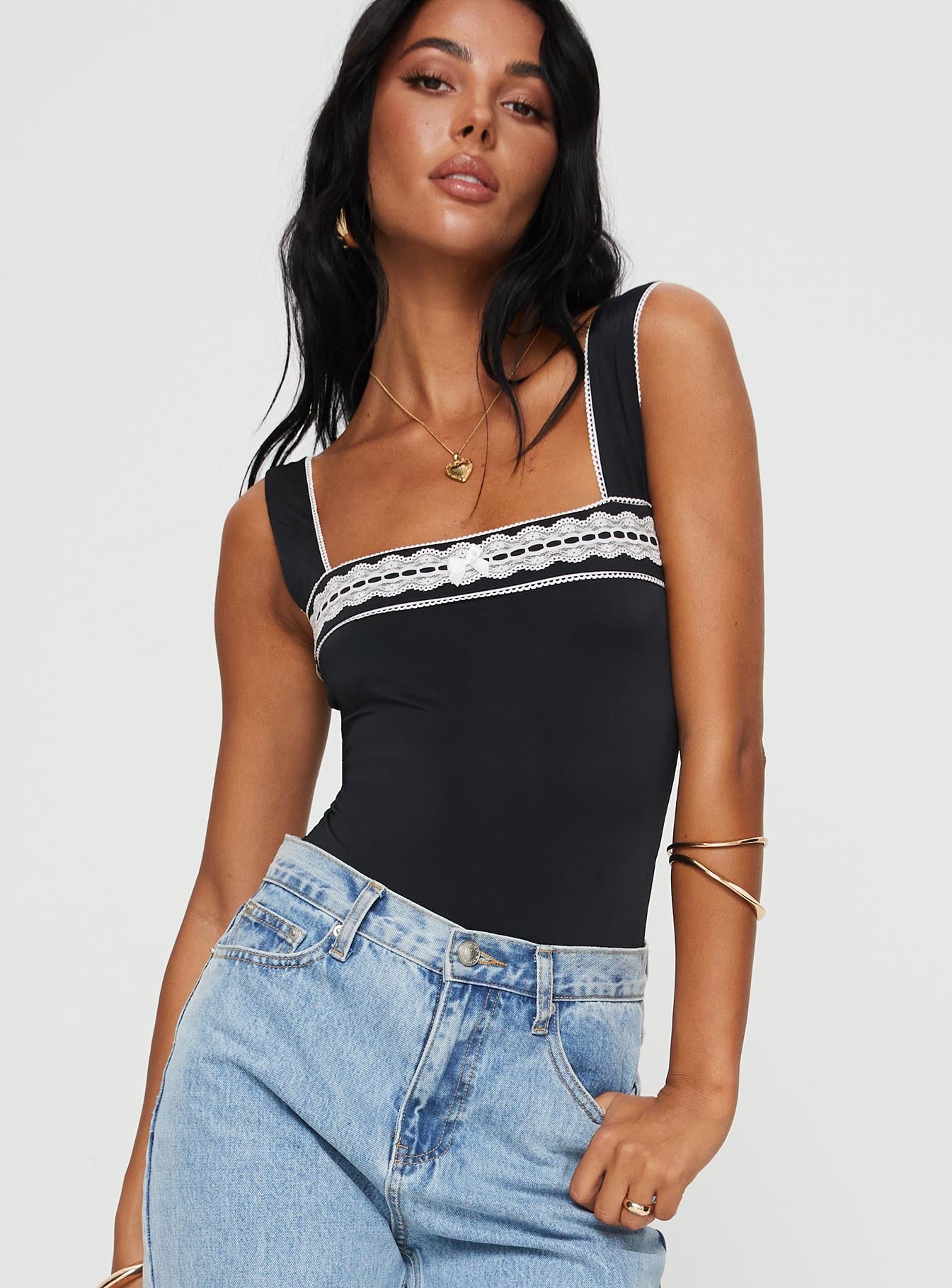 side view of model wearing Princess Polly Keating Bodysuit Black Sleeveless