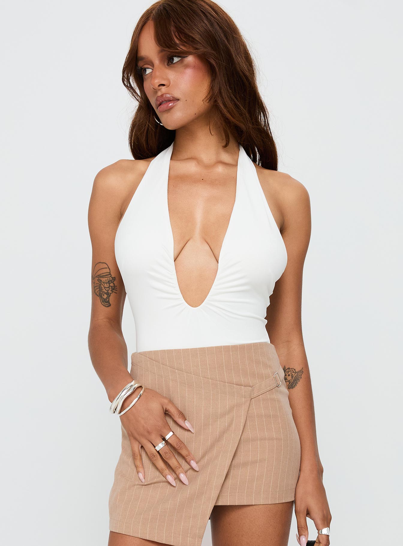 front view of model wearing Princess Polly Emmalyne Plunge Neck Bodysuit White Sleeveless 
