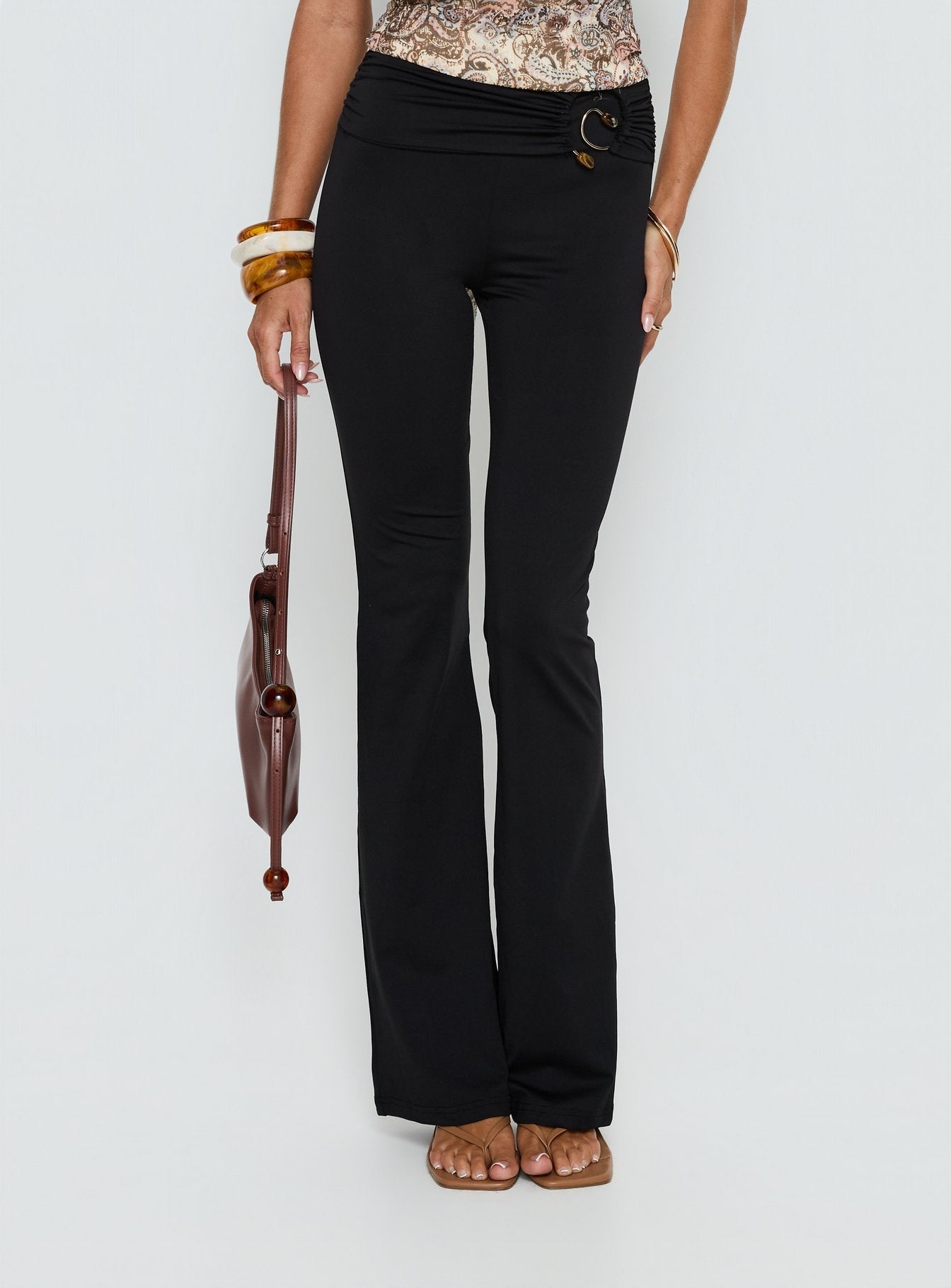 front view of model wearing Princess Polly Kataliah Foldover Flare Pants Black Mid Rise Pants 