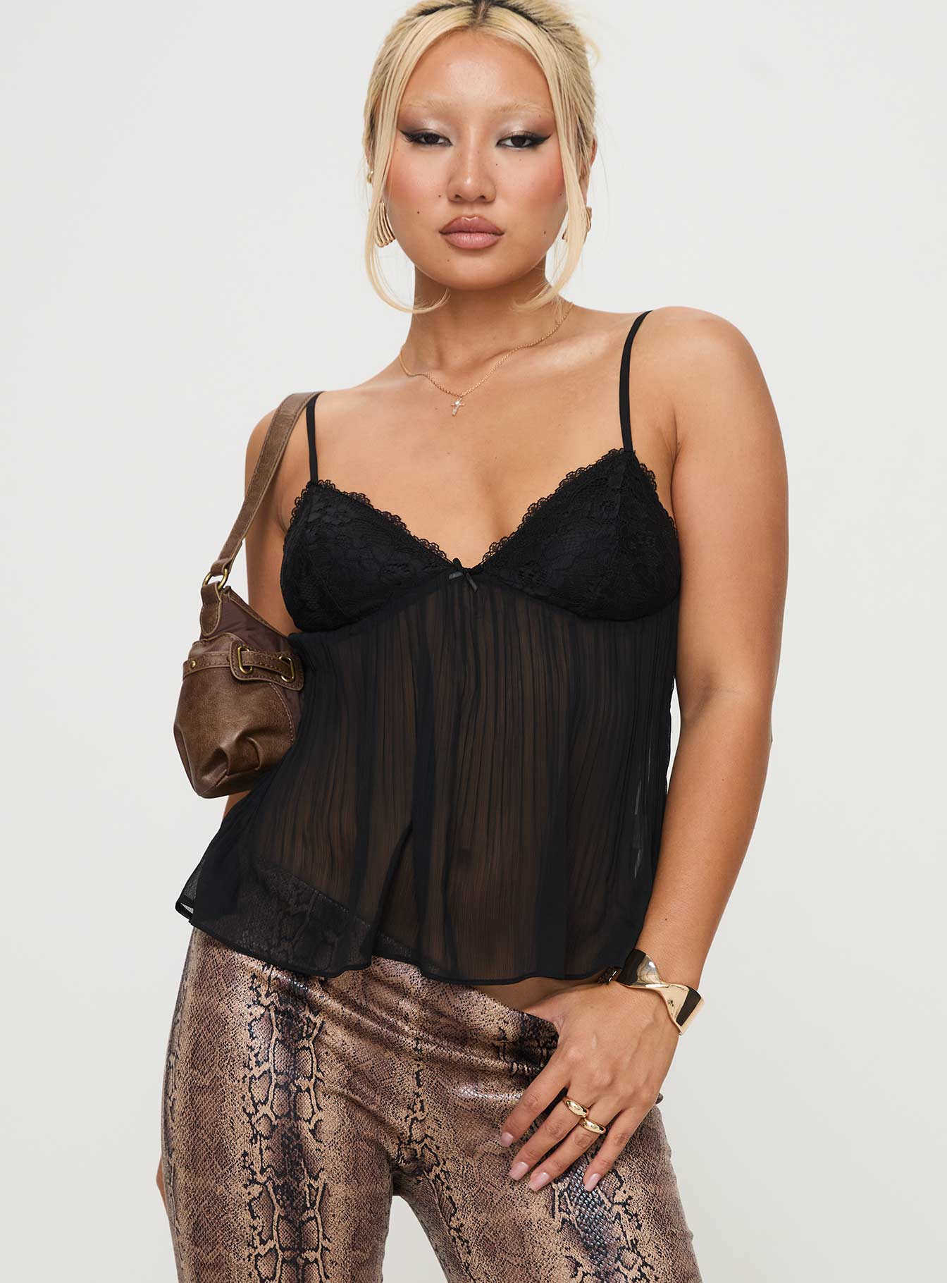side view of model wearing Princess Polly Zami Pleat Top Black Sleeveless V-Neck