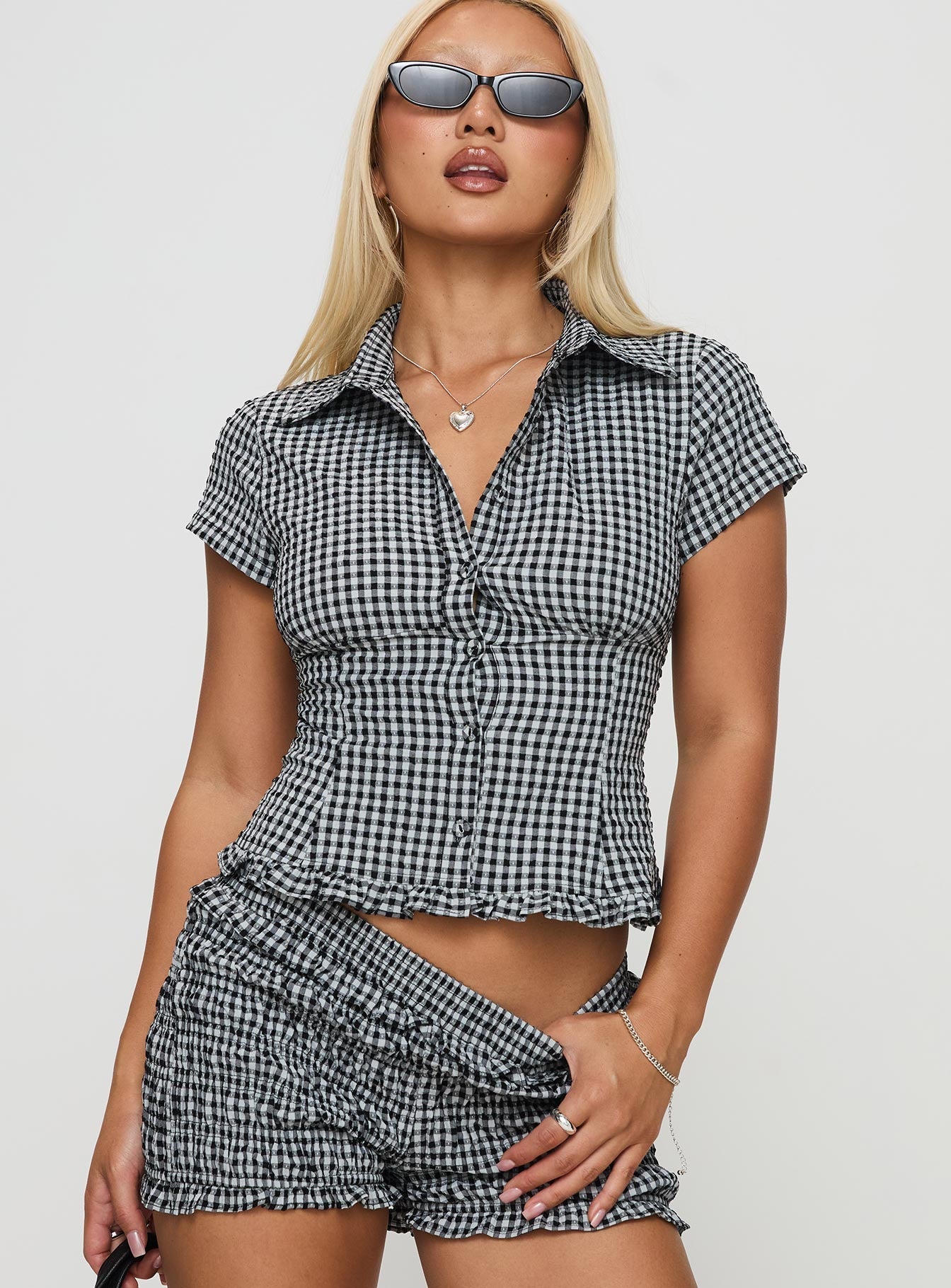 front view of model wearing Princess Polly Covey Shirred Puff Sleeve Top Multi Short Sleeves High Neck 