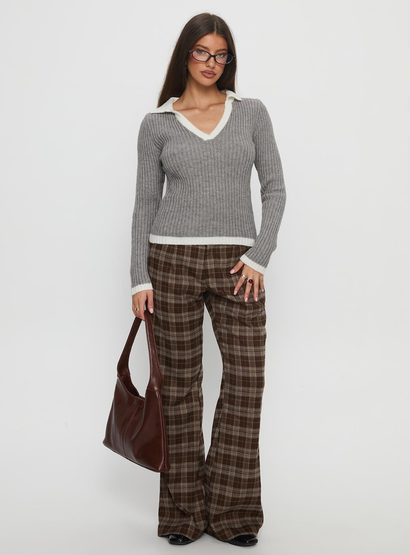 side view of model wearing Princess Polly Emiroki Straight Leg Pants Brown Check Mid Rise Pants 