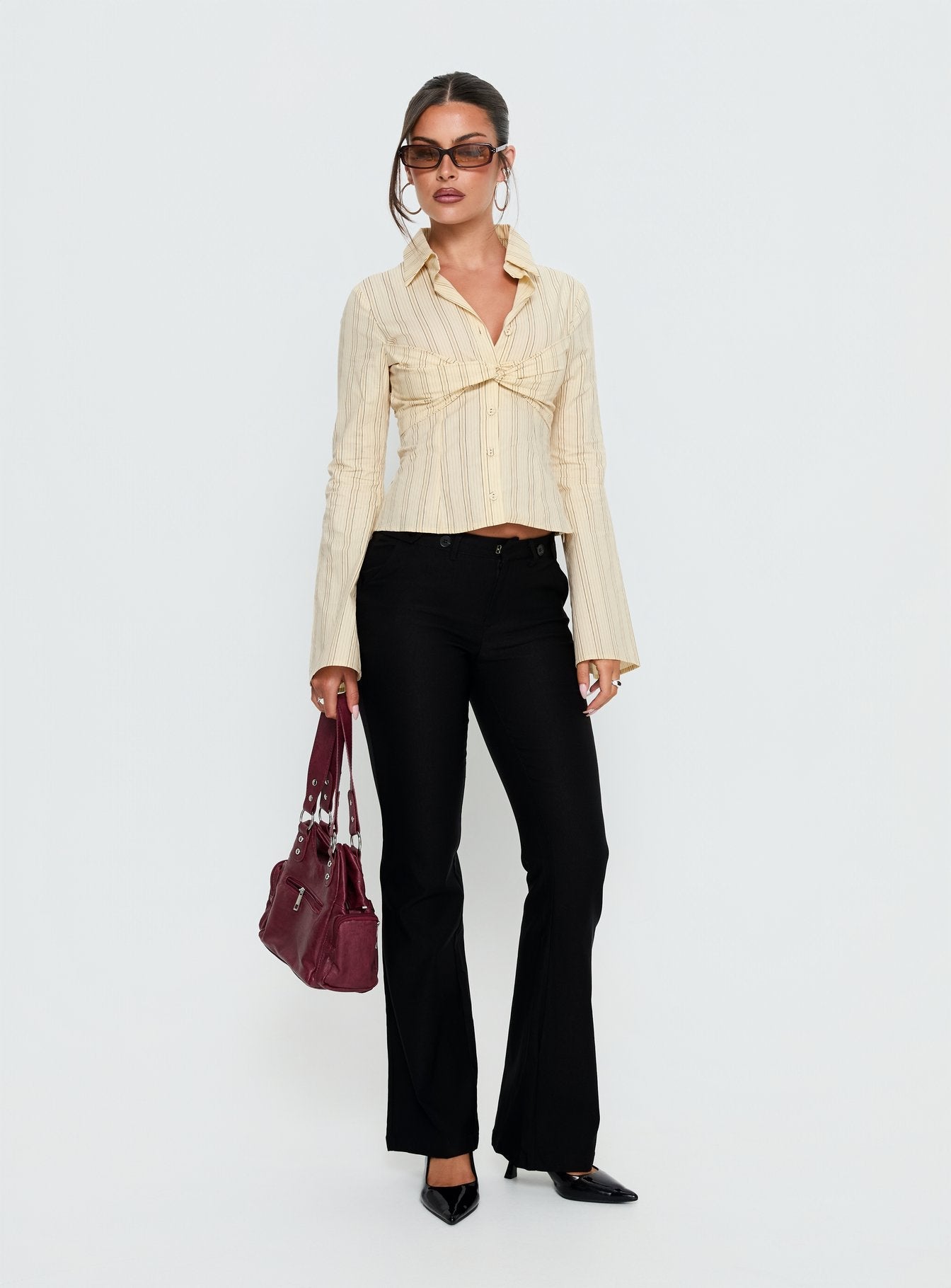 front view of model wearing Princess Polly Dariana Flare Pants Black Mid Rise Pants 