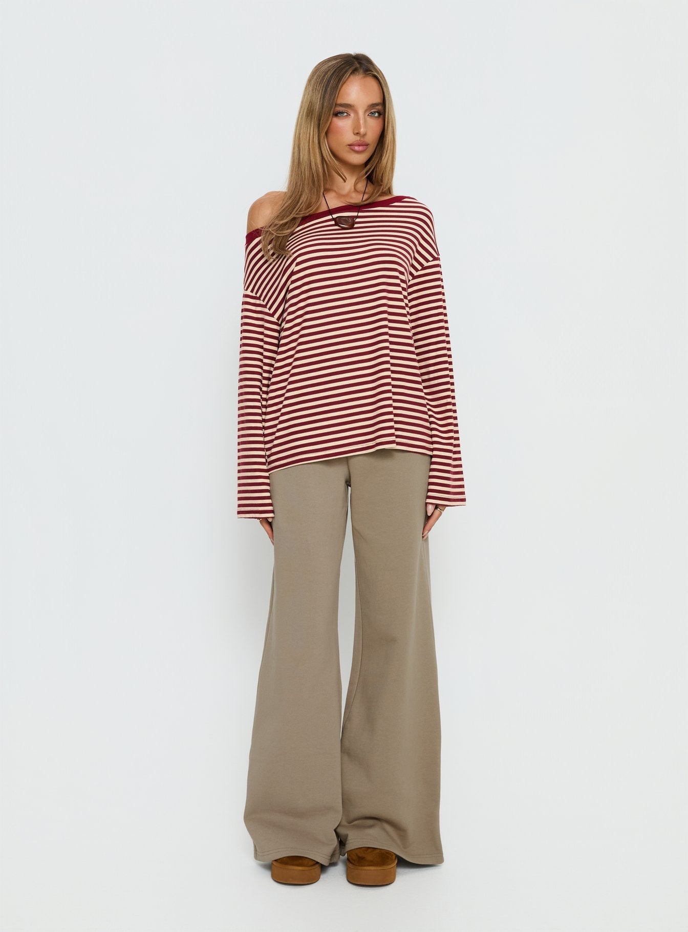 front view of model wearing Princess Polly Summits Flared Track Pants Latte Mid Rise Pants 