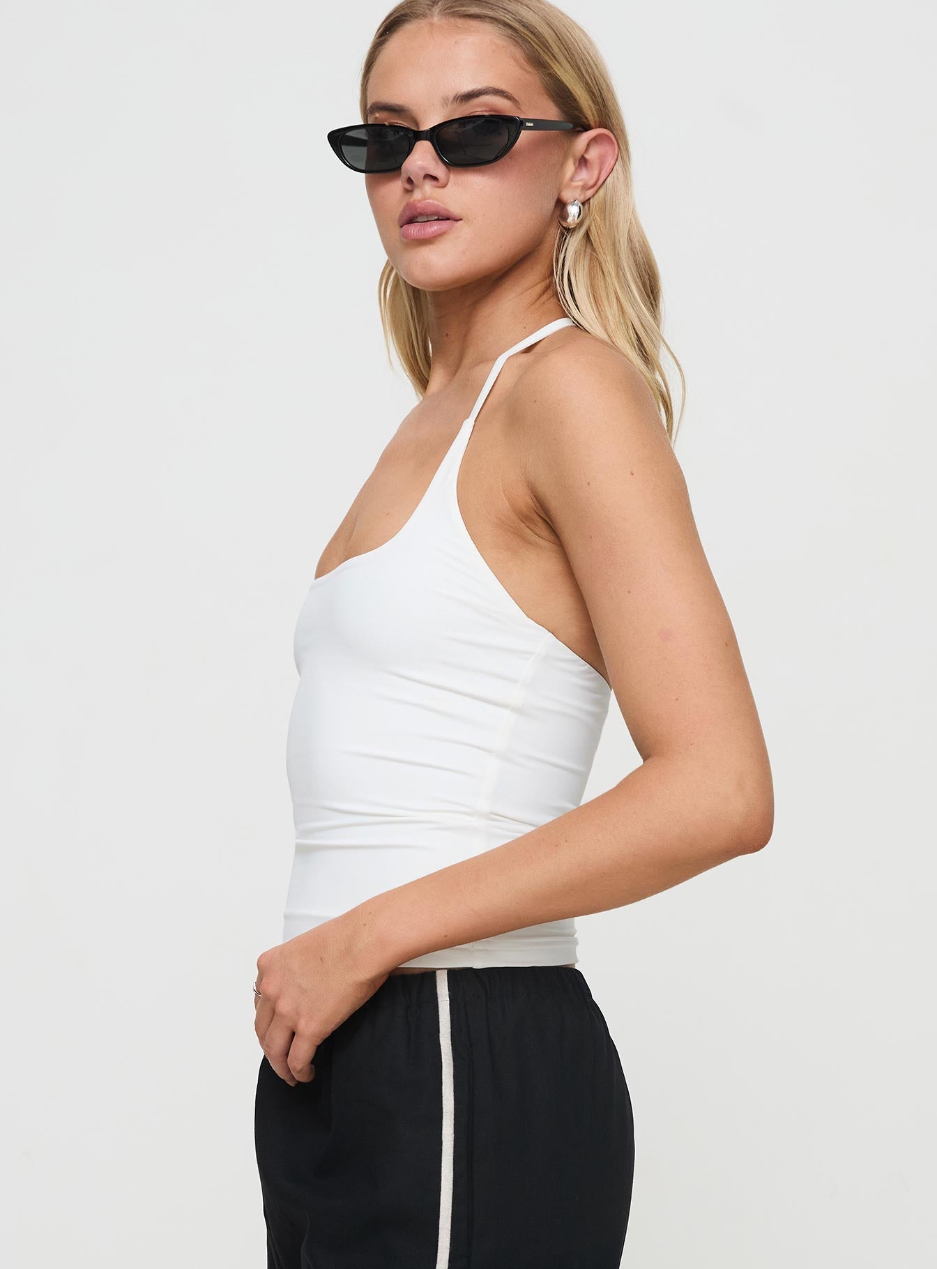 side view of model wearing Princess Polly Ezekiel Nylon Top White Sleeveless Square Neck 