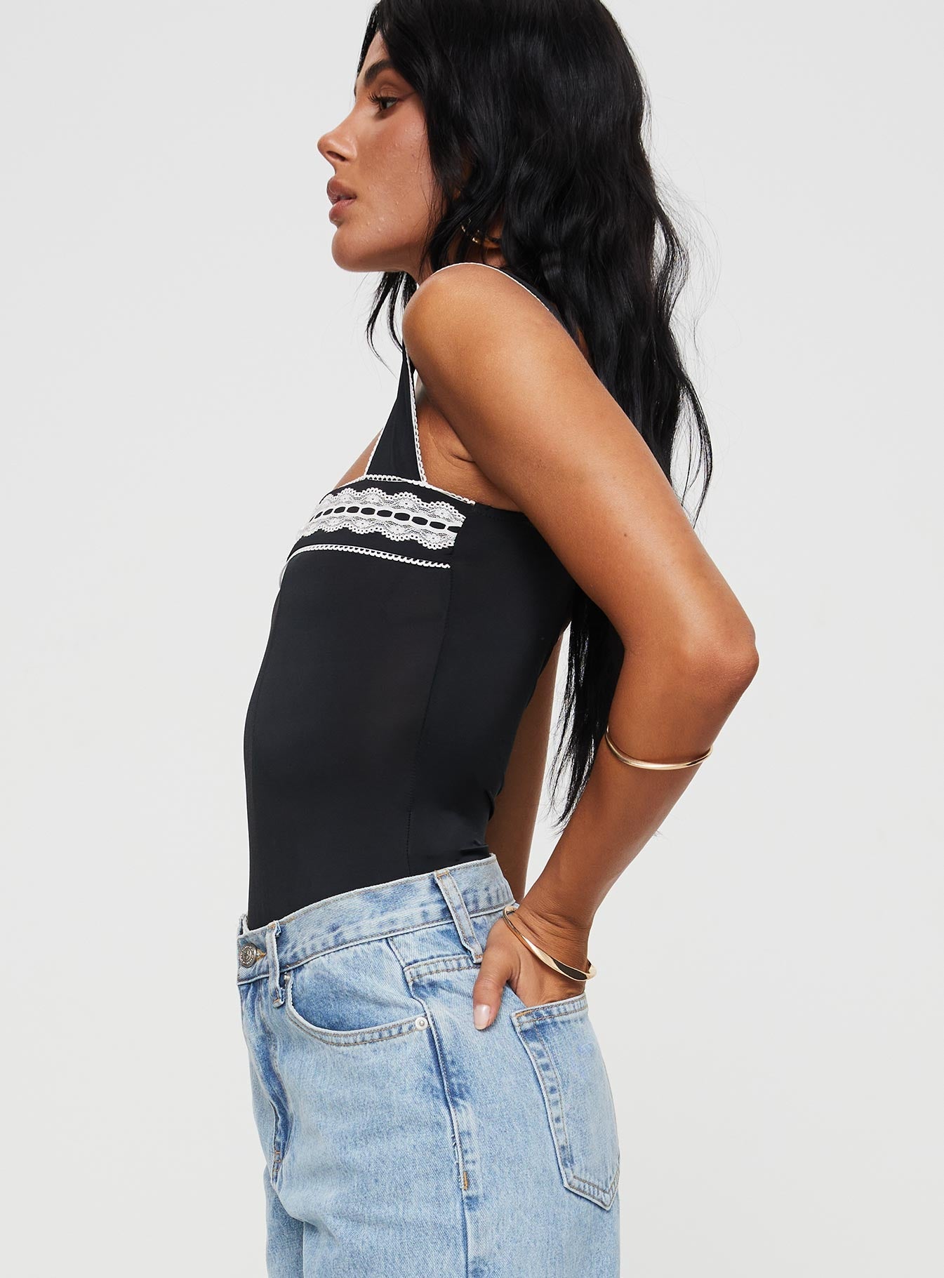 side view of model wearing Princess Polly Keating Bodysuit Black Sleeveless