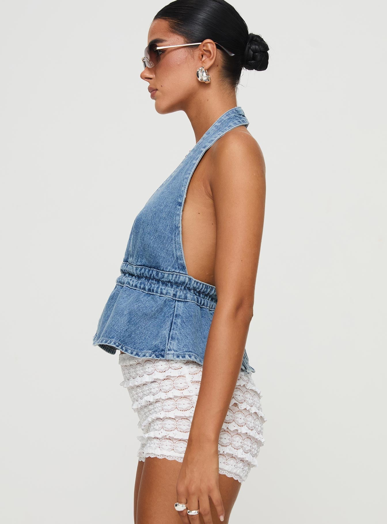 side view of model wearing Princess Polly Sequoia Top Denim Sleeveless Plunger
