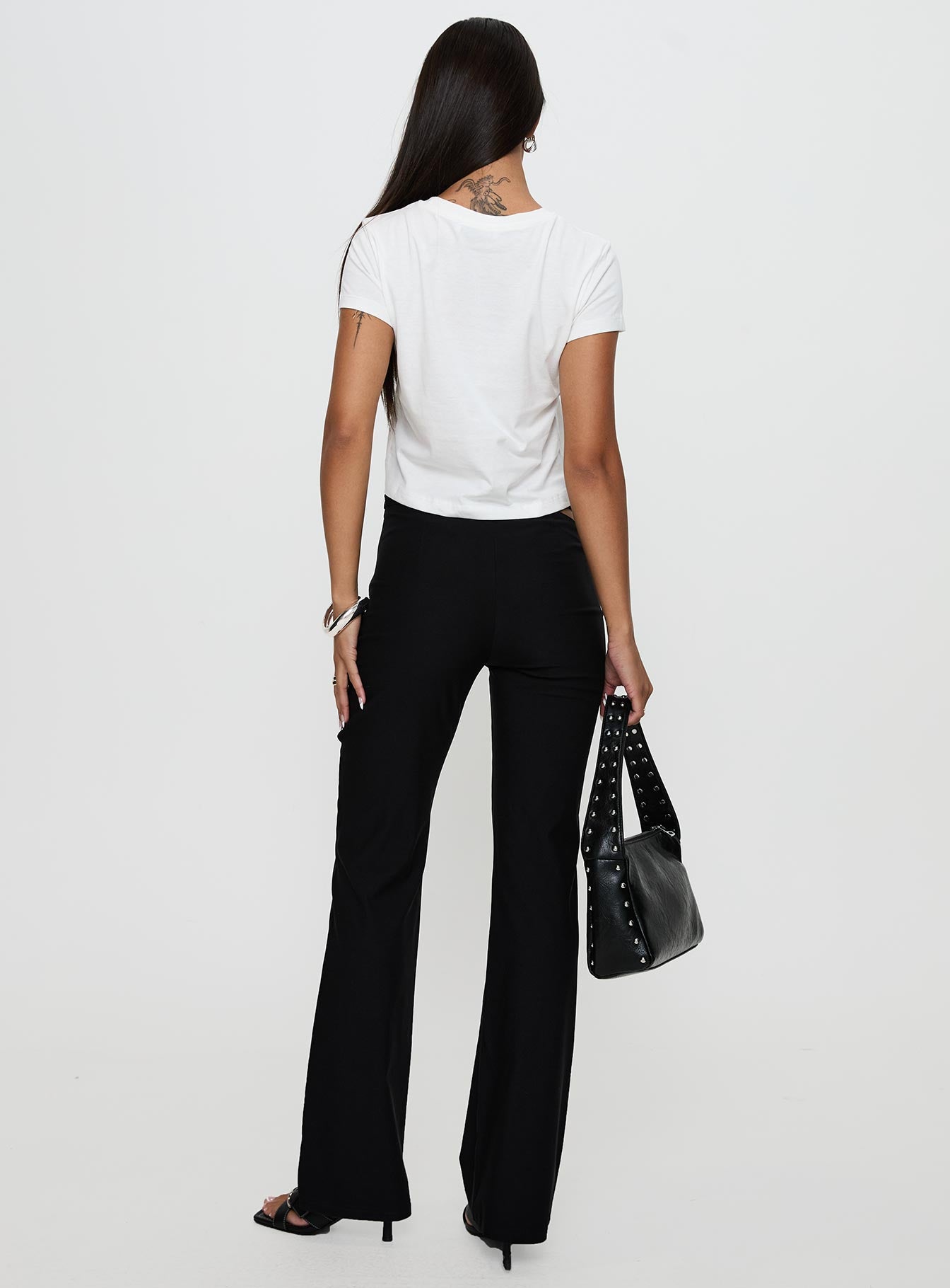 back view of model wearing Princess Polly Eyes On You Flare Pants Black High Waisted Pants 