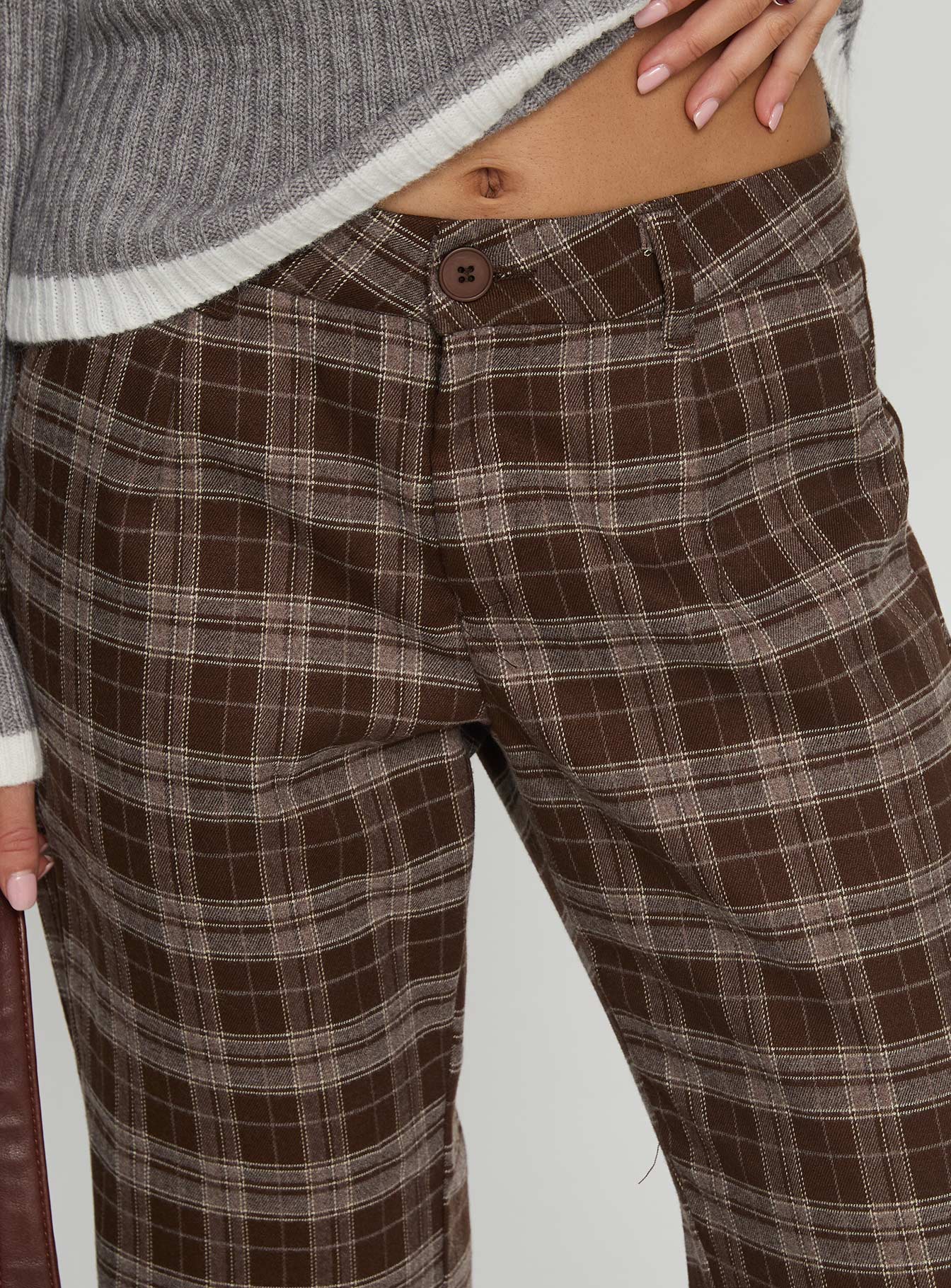 side view of model wearing Princess Polly Emiroki Straight Leg Pants Brown Check Mid Rise Pants 