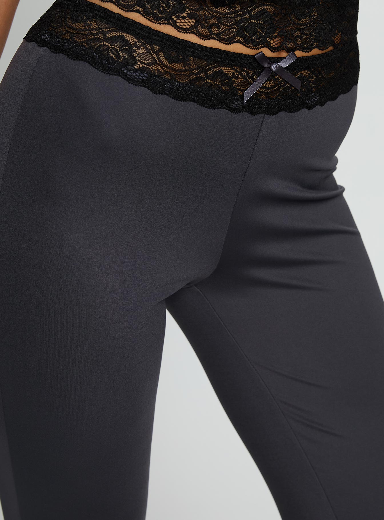 back view of model wearing Princess Polly Georganna Lace Trim Flare Pant Charcoal High Rise Pants 
