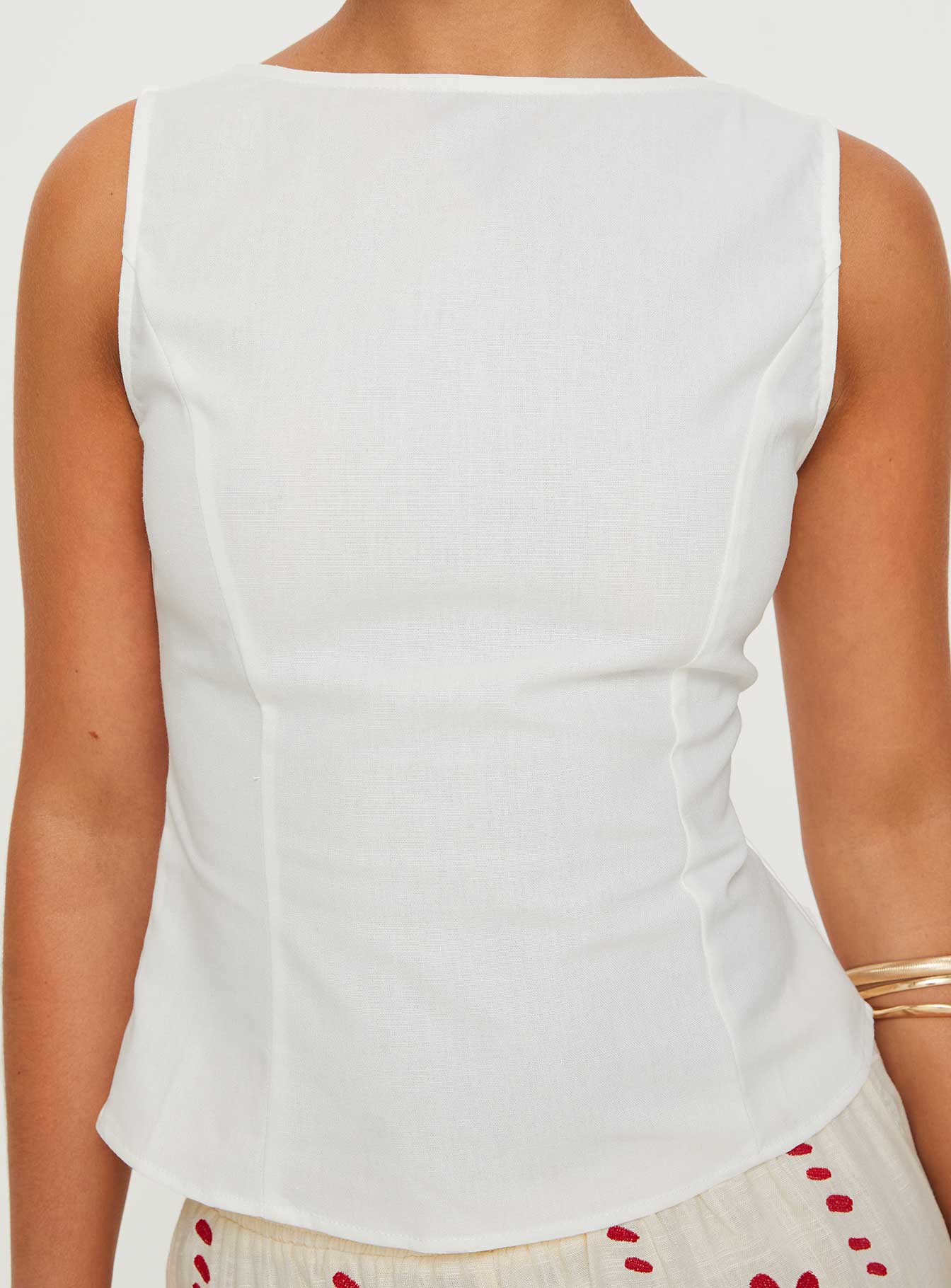 side view of model wearing Princess Polly Lilitina Top White Sleeveless High Neck