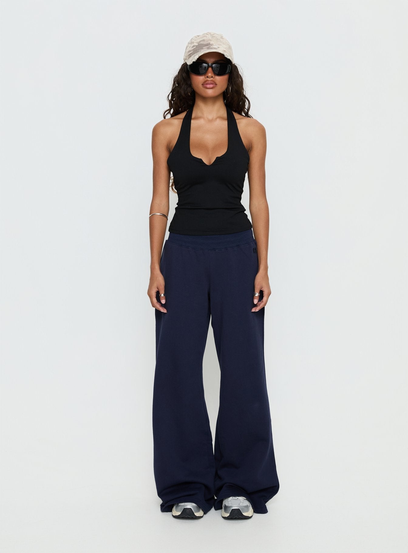 back view of model wearing Princess Polly Summits Flared Track Pants Navy Mid Rise Pants 