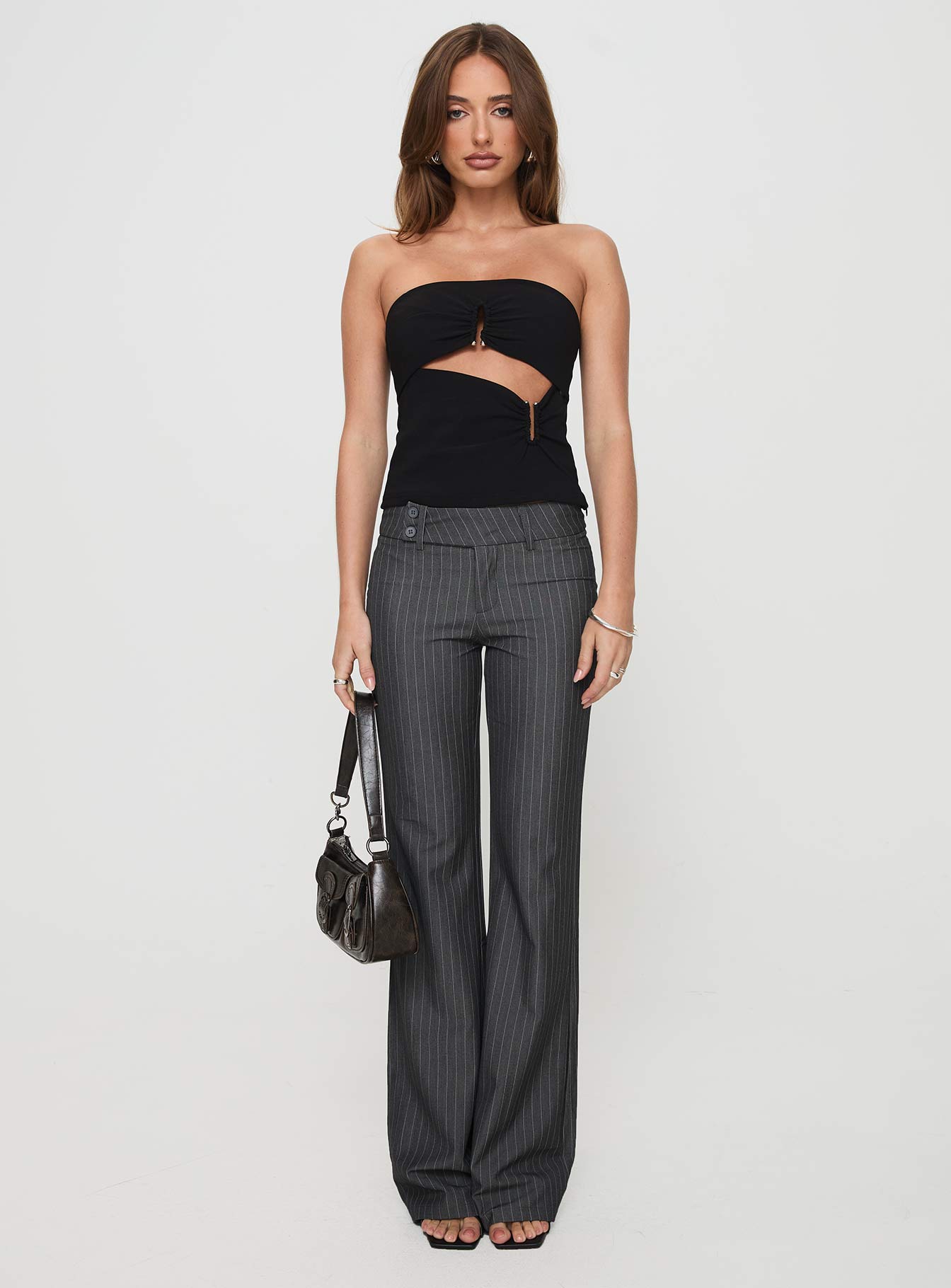 front view of model wearing Princess Polly Kinkirk Flared Pants Grey Pinstripe Low Rise Pants 