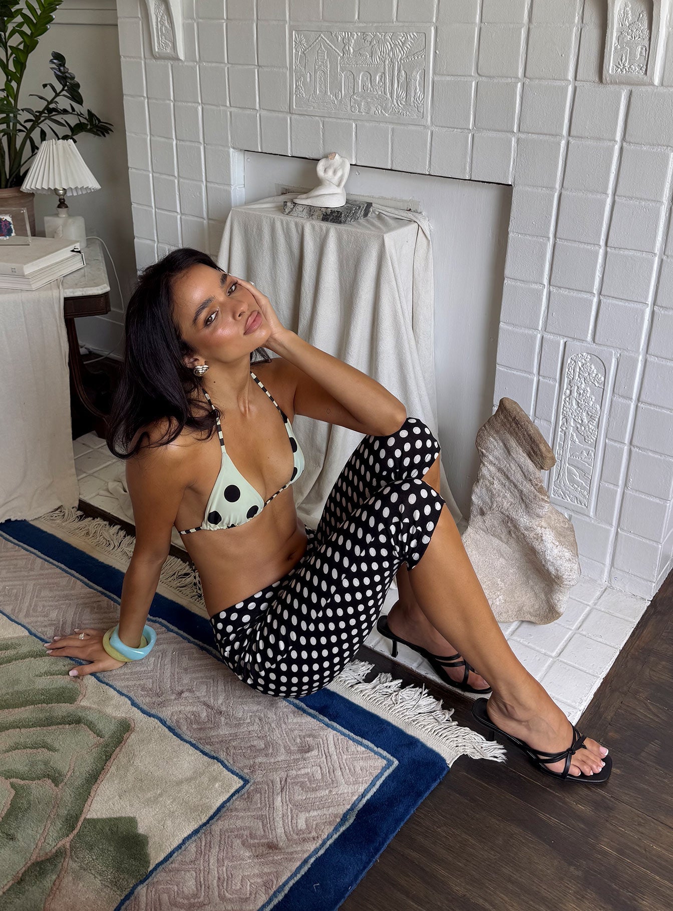 side view of model wearing Princess Polly Isadonna Capri Pants Black Polka Dot Mid Rise Pants 