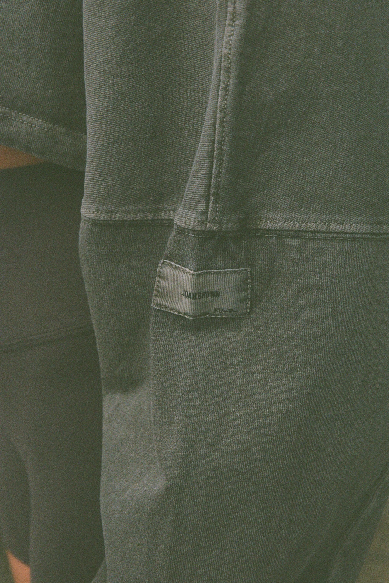 Close up detail view of the sleeve of the  cropped relaxed fit haze cotton Slouchy Crop Long Sleeve top with a crew neckline, dropped shoulders and oversized sleeves